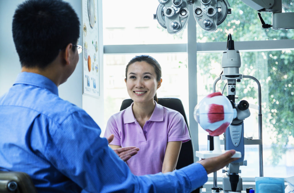 Optometrist discussing with patient their eye exam results