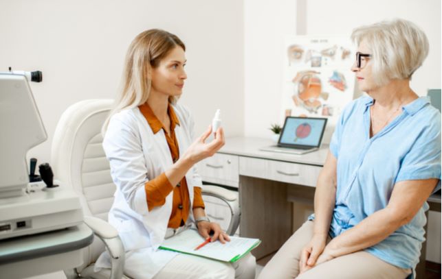 Patient talking to optometrist about her options for eye drop concerning dry eye