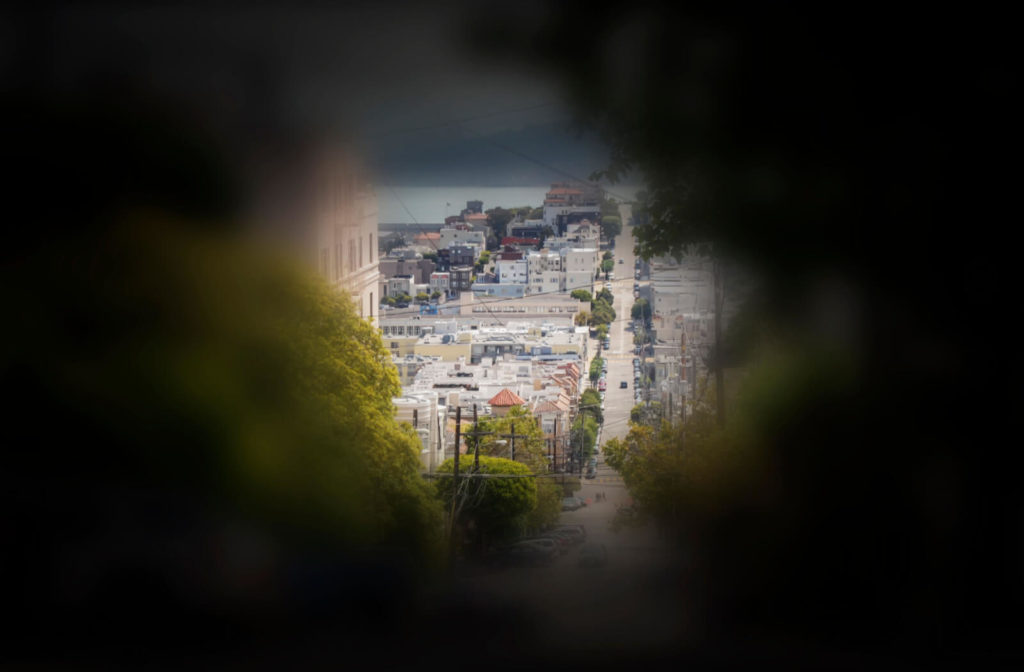 An example of side vision loss. An image of someone looking at a street, the center vision intact and the side vision getting darker due to glaucoma