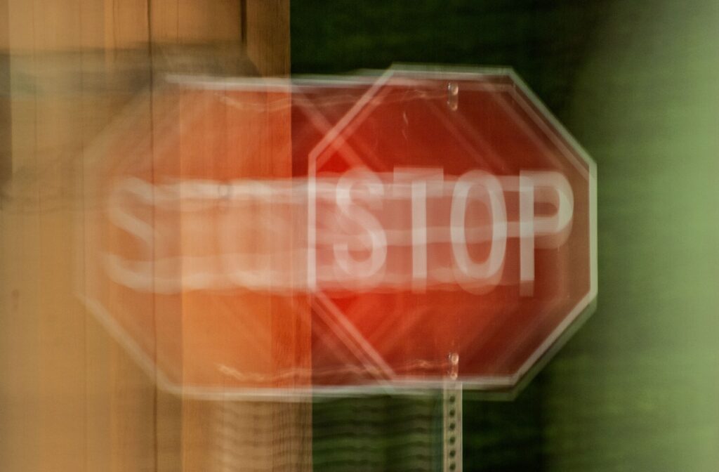 An image of a stop sign demonstrating blurry double vision.